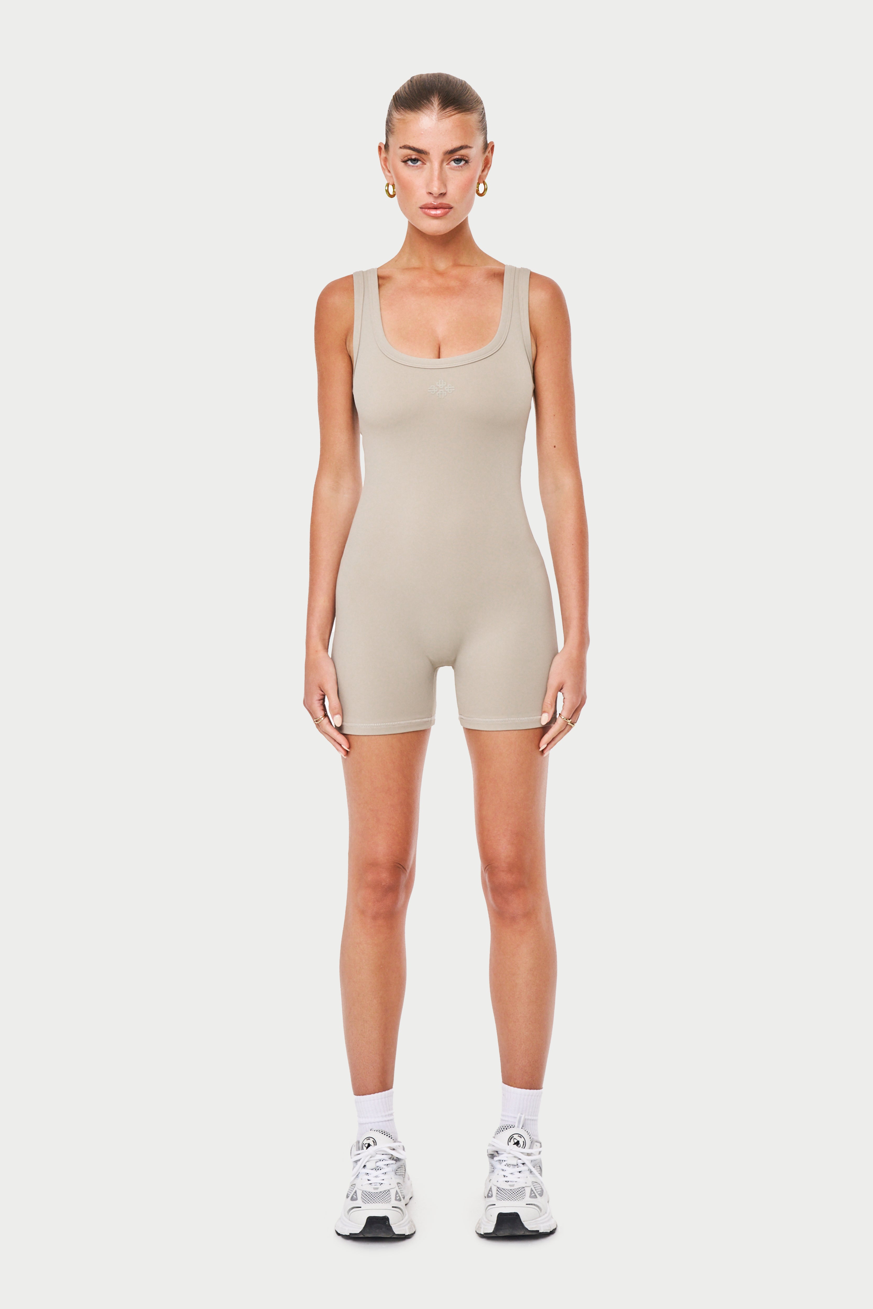 SCULPTING STRETCH EMBLEM UNITARD - BEIGE – The Couture Club