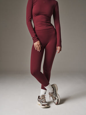 SCULPTING STRETCH EMBLEM LONG SLEEVE TOP - DEEP RED